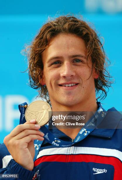 Ryan Lochte of the United States receives the bronze medal during the medal ceremony for theMen's 200m Backstroke Final during the 13th FINA World...