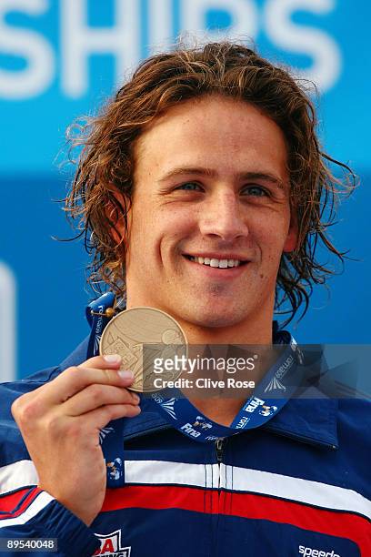 Ryan Lochte of the United States receives the bronze medal during the medal ceremony for theMen's 200m Backstroke Final during the 13th FINA World...