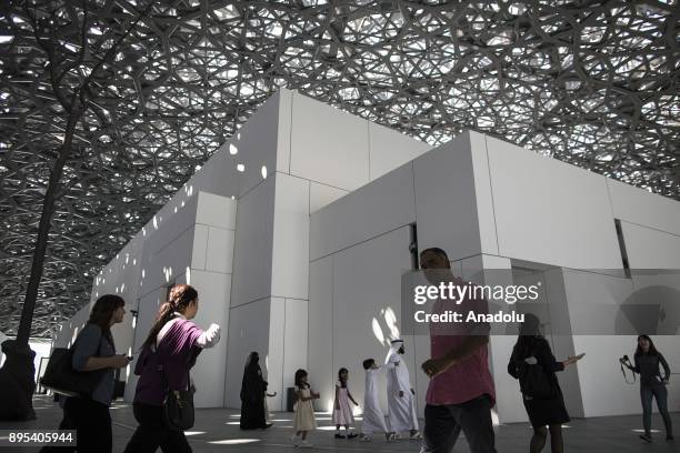 Visitors are seen during the press preview of the "From One Louvre to Another" exhibition at the Louvre Abu Dhabi in Abu Dhabi, United Arab Emirates...