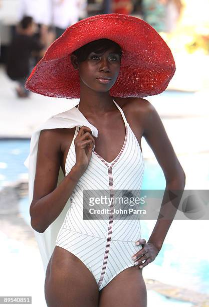 Model walks the runway at Boheme Boutiques 2010 fashion show during Mercedes-Benz Fashion Week Swim at the pool deck at The Raleigh on July 15, 2009...