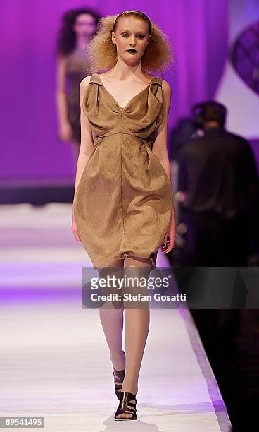 Model showcases a design by One Fell Swoop on the catwalk during the StyleAid Perth Fashion Event 2009 at the Burswood Entertainment Complex on July...