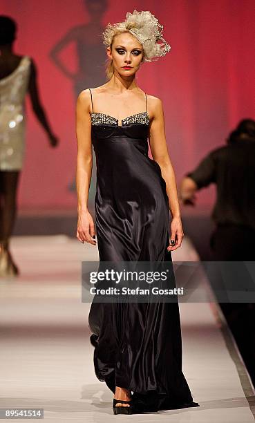 Model showcases a design by Ruth Tarvydas on the catwalk during the StyleAid Perth Fashion Event 2009 at the Burswood Entertainment Complex on July...