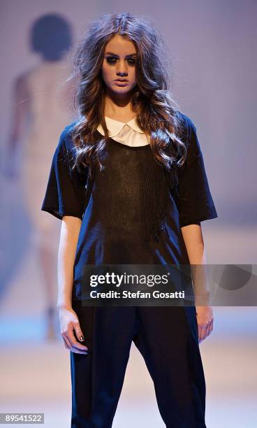 Model showcases a design by Carly Hunter on the catwalk during the StyleAid Perth Fashion Event 2009 at the Burswood Entertainment Complex on July...