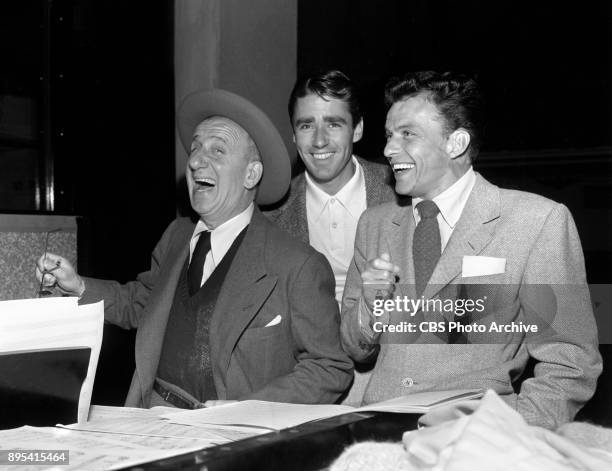 Radio program Songs by Sinatra . Left to right, Jimmy Durante, Peter Lawford and Frank Sinatra. Rehearse for the radio preview of the music from...