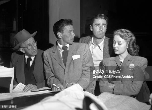 Radio program Songs by Sinatra . Left to right, Left to right, Jimmy Durante, Frank Sinatra, Peter Lawford and Jane Powell rehearse for the radio...