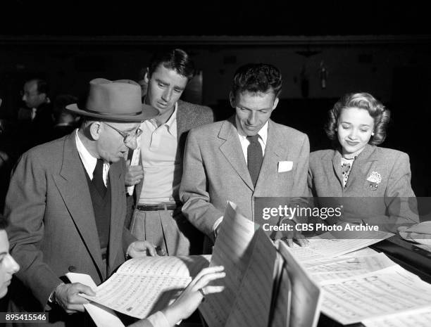 Radio program Songs by Sinatra . Left to right, Jimmy Durante, Peter Lawford, Frank Sinatra and Jane Powell at rehearsal. Image dated February 1,...