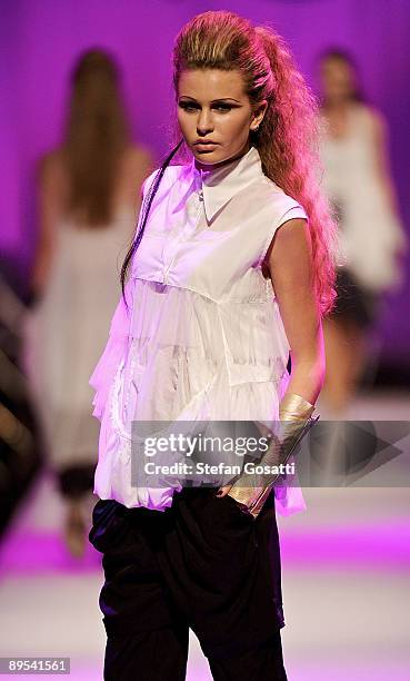 Model showcases a design by Empire Rose on the catwalk during the StyleAid Perth Fashion Event 2009 at the Burswood Entertainment Complex on July 31,...