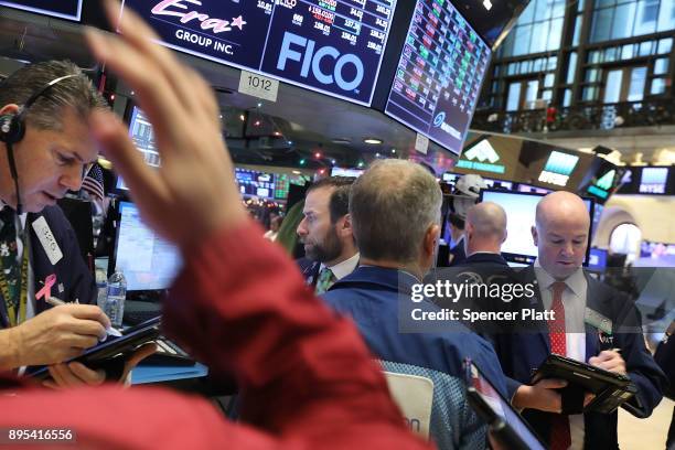 Traders work on the floor of the New York Stock Exchange on December 19, 2017 in New York City. The Dow Jones industrial average rose in morning...