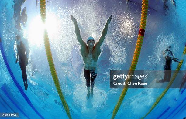 Michael Phelps of the United States competes in the Men's 100m Butterfly Heats during the 13th FINA World Championships at the Stadio del Nuoto on...