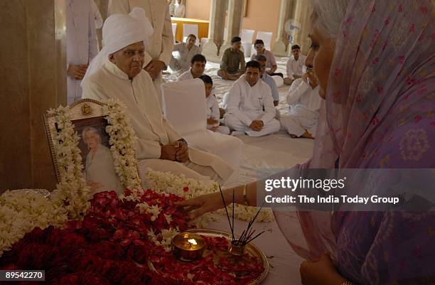 Rajasthan Tourism Minister Bina Kak paying flowring tribute to the Raja Mata Gayatri Devi's body at the city palace on Thursday in Jaipur also seen...