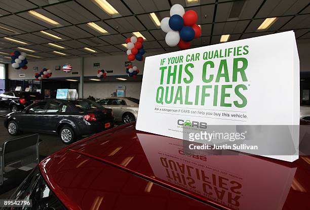Sign advertising the "Cash For Clunkers" program is displayed on a new car at Stewart Chevrolet July 31, 2009 in Colma, California. Federal lawmakers...