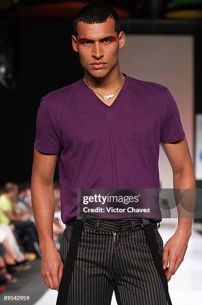 Model walks the runway wearing Divino by Daniel Hoyos during the second day of Colombia Moda 2009 at Plaza Mayor on July 28, 2009 in Medellin,...