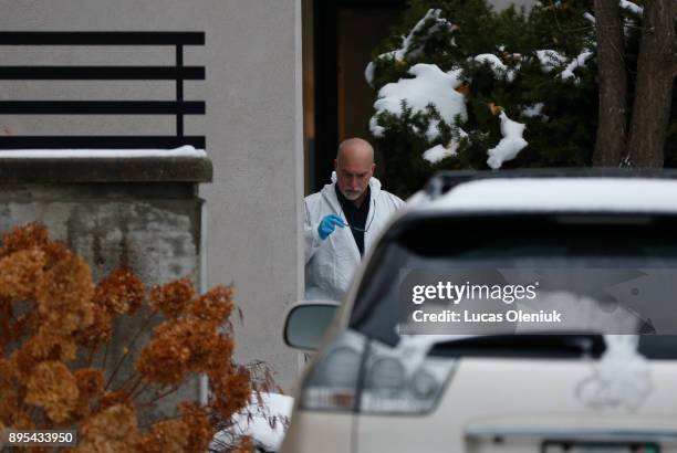 Investigators continue to work the scene at 50 Old Colony Road Monday afternoon following the suspicious death of Barry Sherman and his wife Honey.