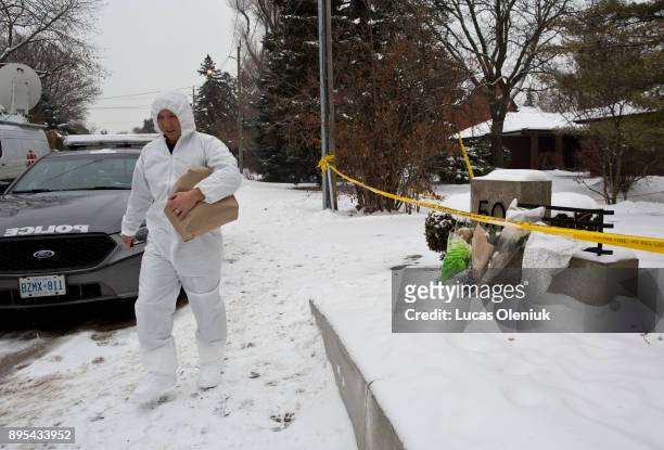 Forensic investigators continued their activities at 50 Old Colony Road following the suspicious deaths of Barry Sherman and his wife Honey. Flowers...