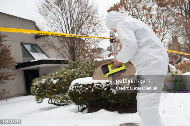 Forensic investigators continued their activities at 50 Old Colony Road following the suspicious deaths of Barry Sherman and his wife Honey. Flowers...