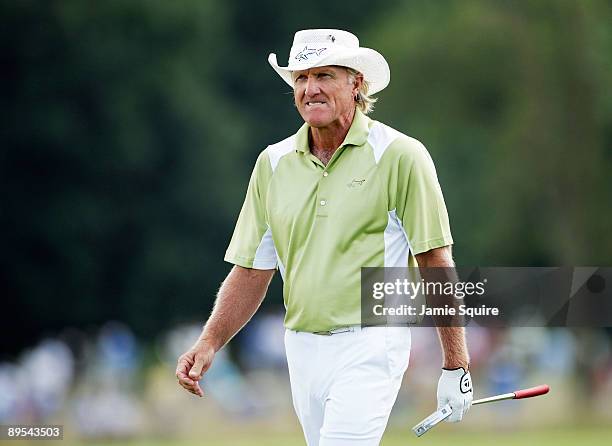 Greg Norman of Australia walks up the fairway after hitting his second shot on the 18th hole during the second round of the 2009 U.S. Senior Open on...
