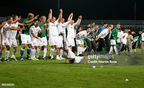 The team of Luebeck celebrate after winning the DFB Cup first round match between VfB Luebeck and FSV Mainz 05 at the Lohmuehlen stadium on July 31,...