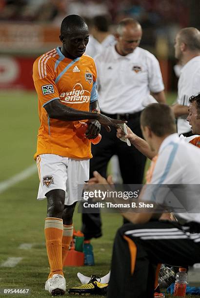 Ade Akinbiyi of the Houston Dynamo substitutes for Dominic Oduro while playing against New England Revolution at Robertson Stadium on July 25, 2009...