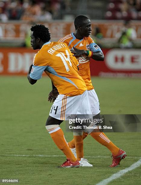 Ade Akinbiyi of the Houston Dynamo substitutes for Dominic Oduro while playing against New England Revolution at Robertson Stadium on July 25, 2009...