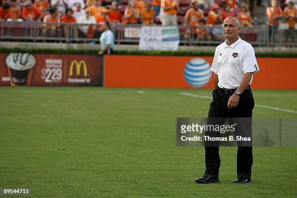 Head coach Dominic Kinnear of the Houston Dynamo walks on the pitch before the Dynamo played against New England Revolution at Robertson Stadium on...