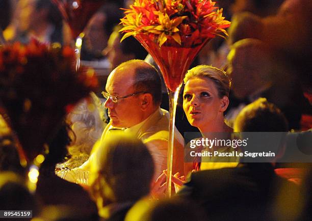 Prince Albert II of Monaco and Charlene Wittstock attend the 61st Monaco Red Cross Ball at the Monte Carlo Sporting Club on July 31, 2009 in Monte...