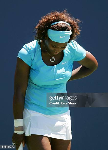 Serena Williams reacts to a missed point against Samantha Stosur of Australia during their quarterfinal match on Day 5 of the Bank of the West...