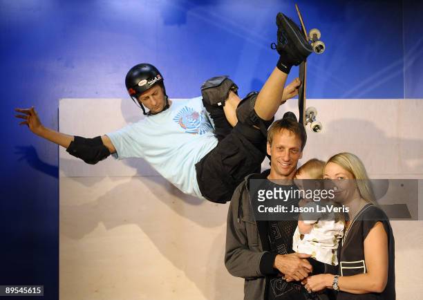 Tony Hawk, Kadence Clover Hawk and Lhotse Hawk attend Tony Hawk's wax figure unveiling ceremony at Madame Tussauds on July 29, 2009 in Hollywood,...