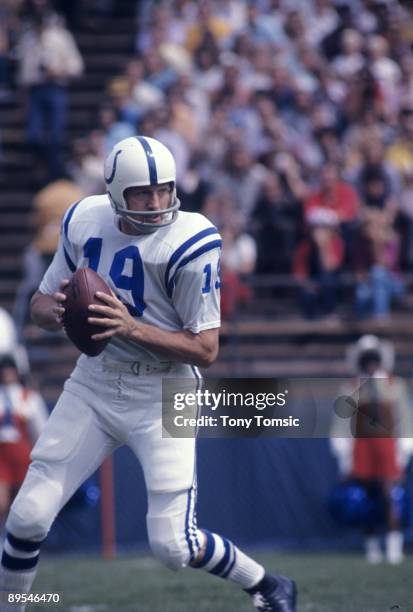 Quarterback Johnny Unitas of the Baltimore Colts rolls out as he sets up to pass during a preseason game on September 10, 1972 against the Denver...