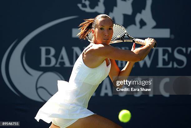 Jelena Jankovic of Serbia returns a shot to Marion Bartoli of France during their quarterfinal match on Day 5 of the Bank of the West Classic July...