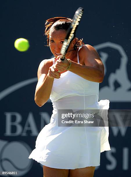 Jelena Jankovic of Serbia returns a shot to Marion Bartoli of France during their quarterfinal match on Day 5 of the Bank of the West Classic July...