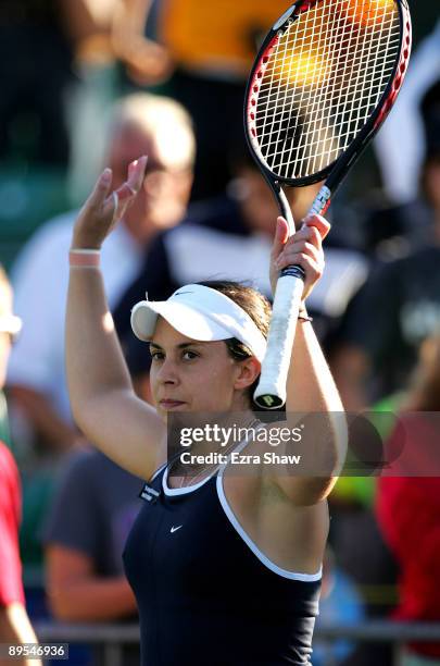 Marion Bartoli of France waves to the crowd after beating Jelena Jankovic of Serbia in their quarterfinal match on Day 5 of the Bank of the West...