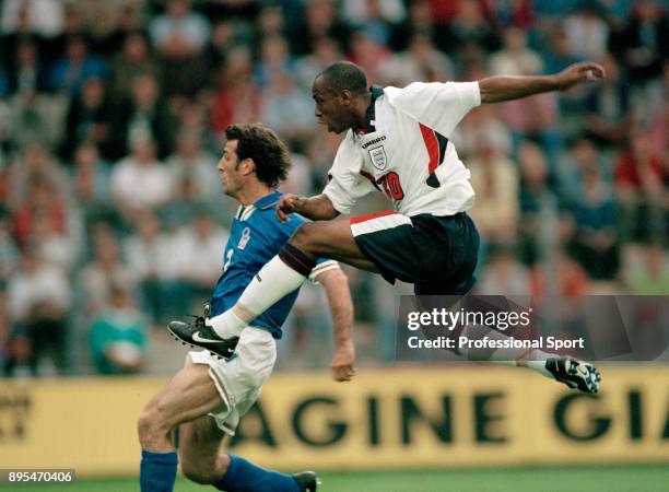 Ian Wright of England scores as Ciro Ferrara of Italy looks on during a Tournoi de France match at the Stade de la Beaujoire on June 04, 1997 in...