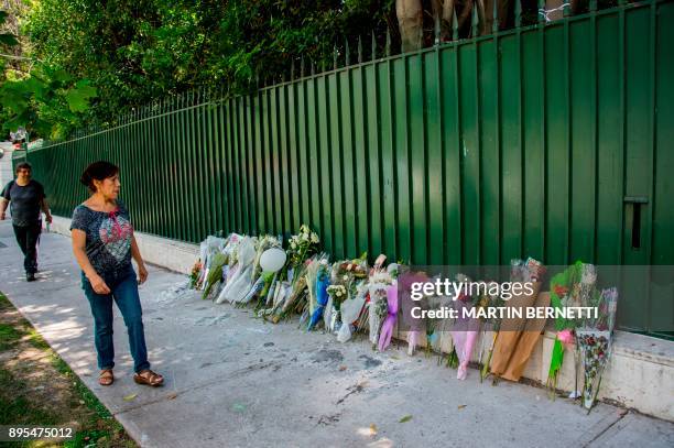 Flowers placed by fans of Kim Jong-Hyun, a 27-year-old lead singer of the massively popular K-pop boyband SHINee, are seen outside the South Korean...