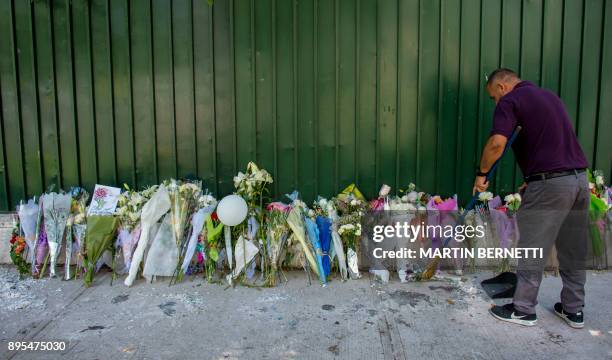 Flowers placed by fans of Kim Jong-Hyun, a 27-year-old lead singer of the massively popular K-pop boyband SHINee, are seen outside the South Korean...