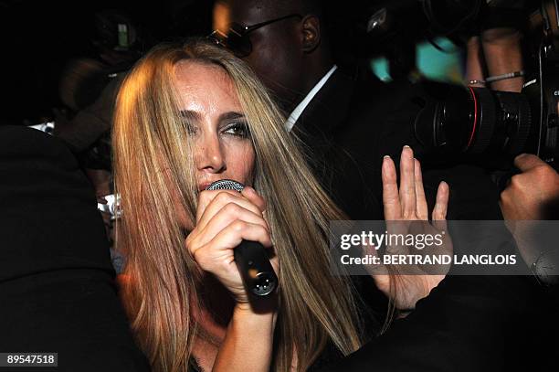Patrizia D'Addario, the call girl who claims to have slept with Italian Prime Minister Silvio Berlusconi, performs at an "I love Silvio" theme party...