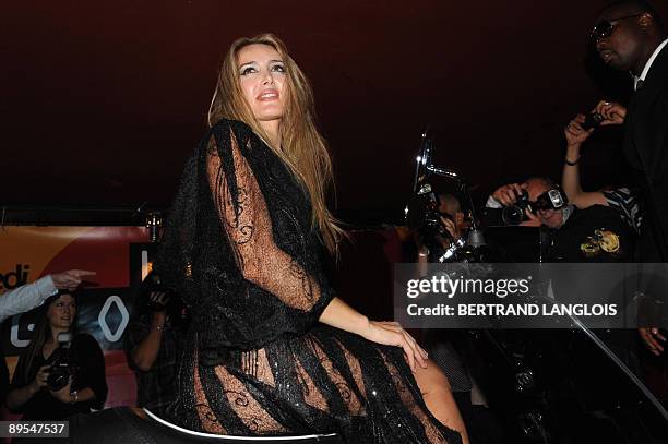 Patrizia D'Addario, the call girl who claims to have slept with Italian Prime Minister Silvio Berlusconi, poses at an "I love Silvio" theme party in...