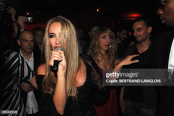 Patrizia D'Addario, the call girl who claims to have slept with Italian Prime Minister Silvio Berlusconi, performs at an "I love Silvio" theme party...