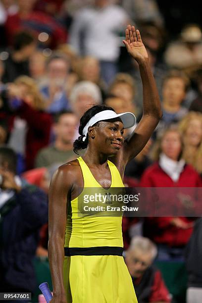 Venus Williams waves to the crowd after beating Maria Sharapova of the USA in their quarterfinal match on Day 5 of the Bank of the West Classic July...