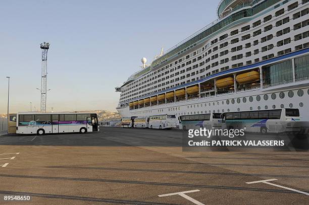 Bus stand on the parking in front of he cruise boat Voyager of the seas on August 1, 2009 at the harbour of Marseille, southeastern France....
