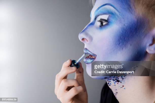 Joshua Cargill aka Blu Hydrangea is photographed getting into drag backstage as part 'Visage' a collaborative exhibition with designer Aaron Eakin...