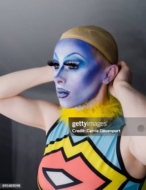 Joshua Cargill aka Blu Hydrangea is photographed getting into drag backstage as part 'Visage' a collaborative exhibition with designer Aaron Eakin...