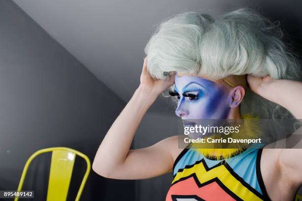 Joshua Cargill aka Blu Hydrangea is photographed getting into drag backstage as part 'Visage' a collaborative exhibition with designer Aaron Eakin...