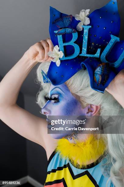 Joshua Cargill aka Blu Hydrangea is photographed getting into drag backstage as part 'Visage' a collaborative exhibition with designer Aaron Eakin...