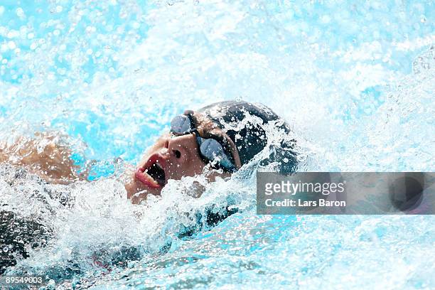 Glenn Victor Sutanto of Indonesia competes in the Men's 50m Backstroke Heats during the 13th FINA World Championships at the Stadio del Nuoto on...
