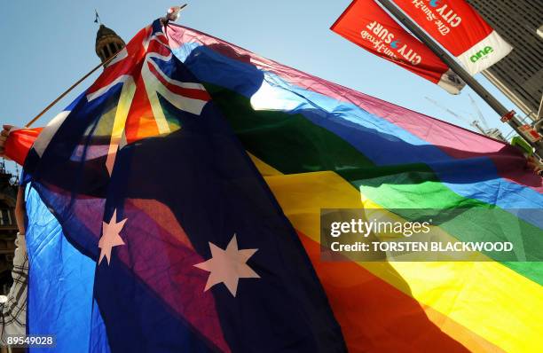 Protester shows his colours during a gay rights march through Sydney to the ruling Labor Party's conference to stage a mass "illegal wedding" stunt...