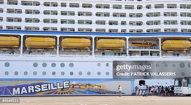 Passengers of the cruise boat Voyager of the seas leave the boat on August 1, 2009 at the harbour of Marseille, southeastern France. The luxury...