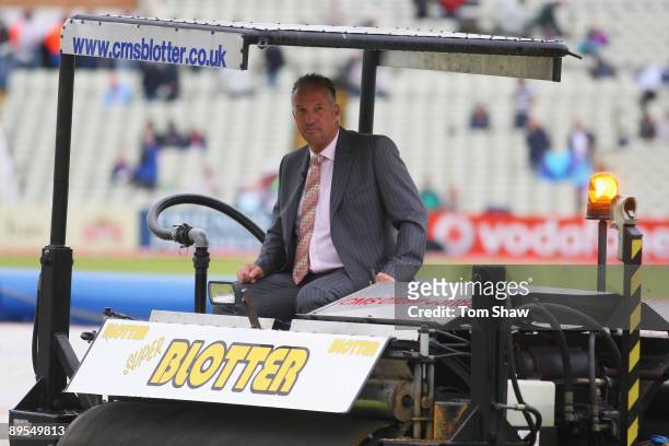 Sky commentator Ian Botham drives the Blotter to remove surface water after rain during day three of the npower 3rd Ashes Test Match between England...