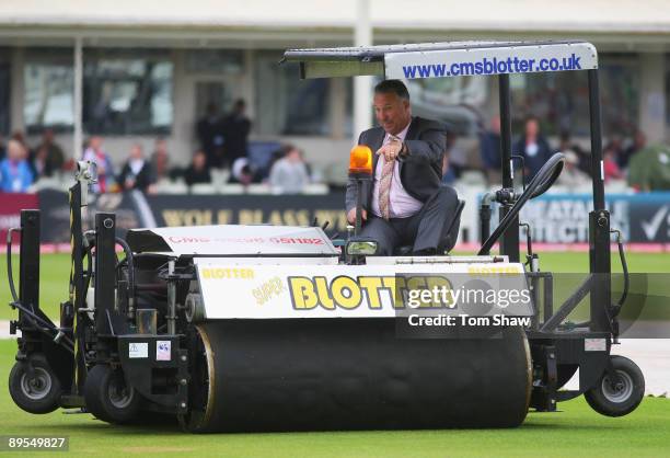 Sky commentator Ian Botham drives the Blotter to remove surface water after rain during day three of the npower 3rd Ashes Test Match between England...