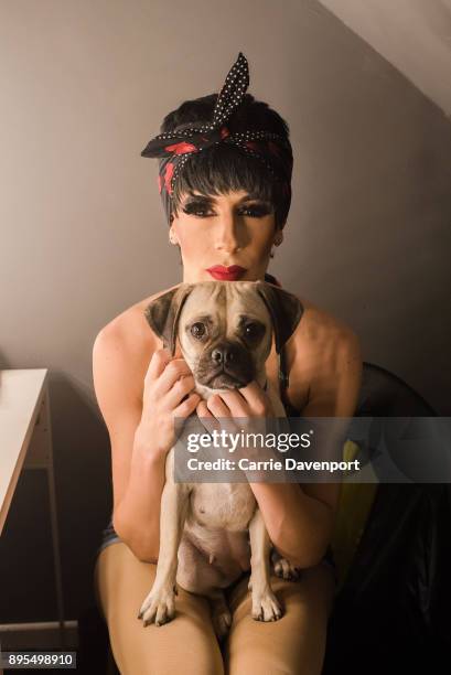 Matthew Cavan aka Cherrie Ontop is photographed getting into drag backstage as part 'Visage' a collaborative exhibition with designer Aaron Eakin and...