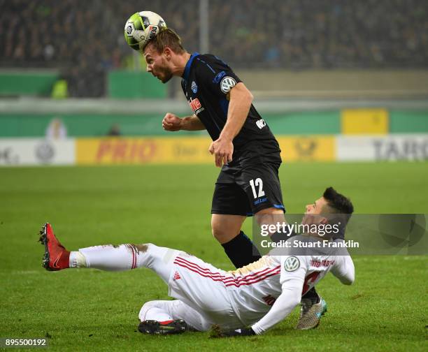 Felix Herzenbruch of Paderborn is challenged by Alfredo Morales of Ingolstadt during the DFB Cup match between SC Paderborn and FC Ingolstadt at...